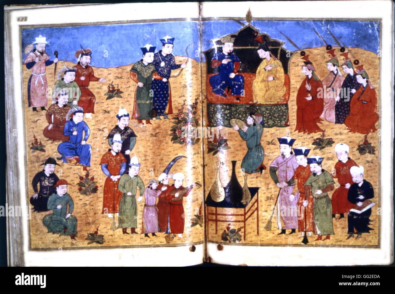 Manuscrit persan illustré de 106 tableaux : 'Jami'al Tawarikh" par Rachid ad-Dîn (Histoire des Mongols). Le souverain Mongol de Perse, Ghazan Khan, sur le trône avec l'une de ses épouses et entouré de courtisans. 14ème siècle de l'école persane Banque D'Images
