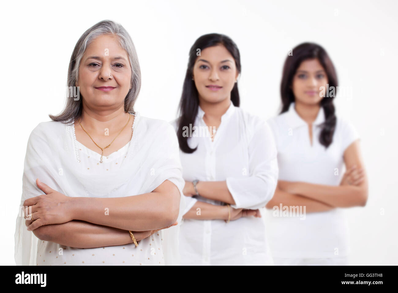Portrait de multi generation family standing over white background Banque D'Images
