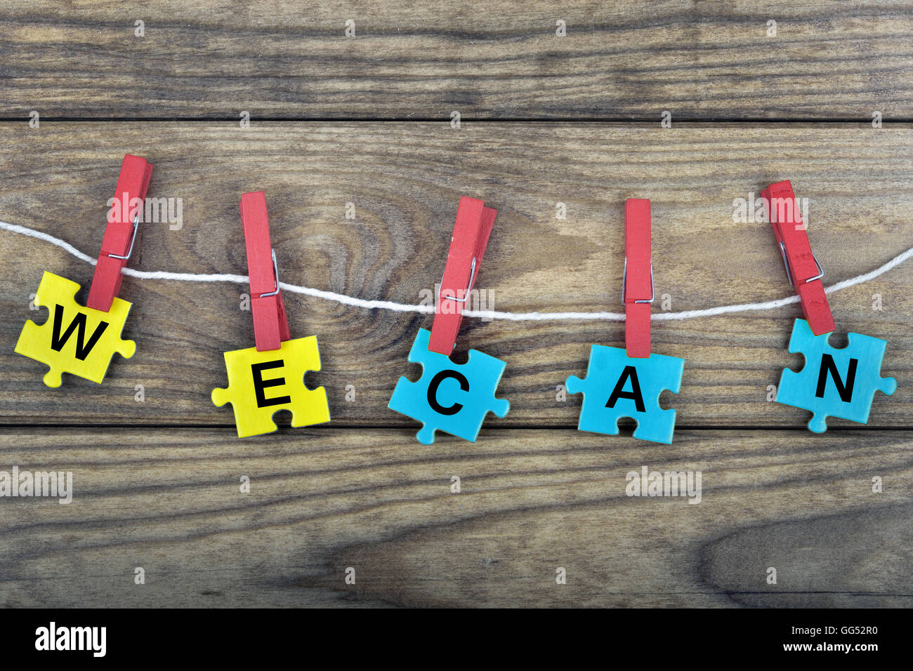 Pièces du puzzle avec word nous pouvons Banque D'Images