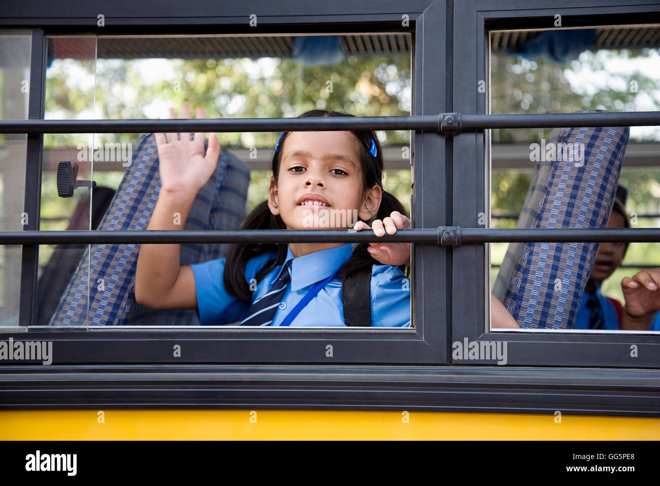 School girl sitting in a school bus Banque D'Images