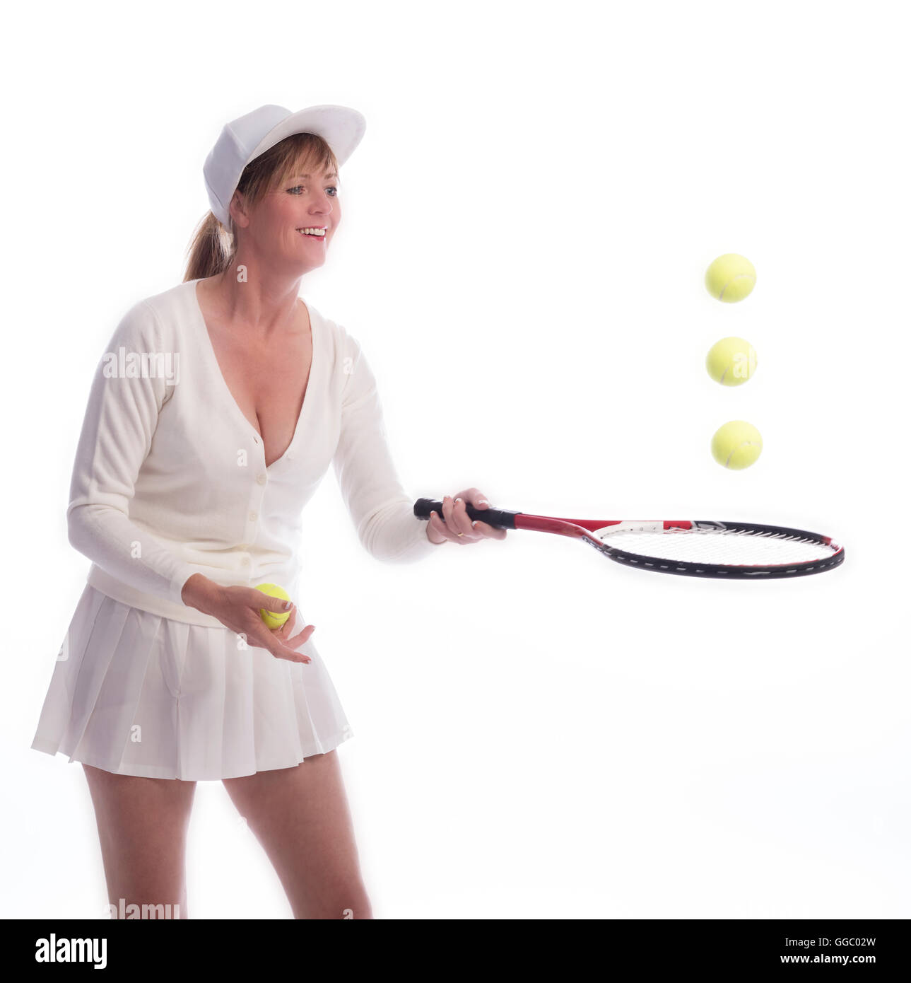 Joueur de tennis femme avec une raquette et des balles de rebonds Banque D'Images