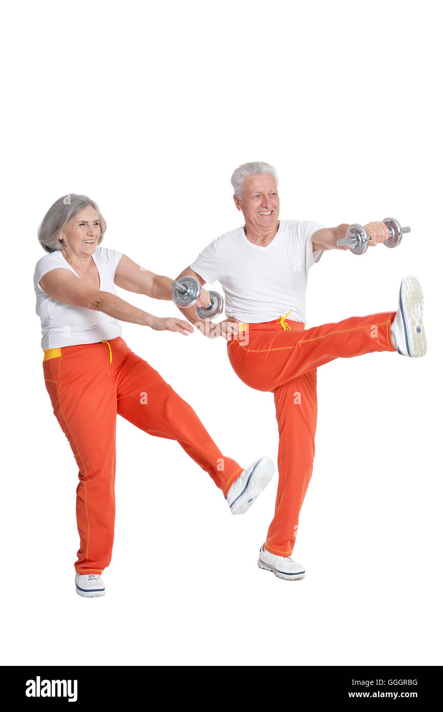 Senior Couple Exercising with dumbbells Banque D'Images