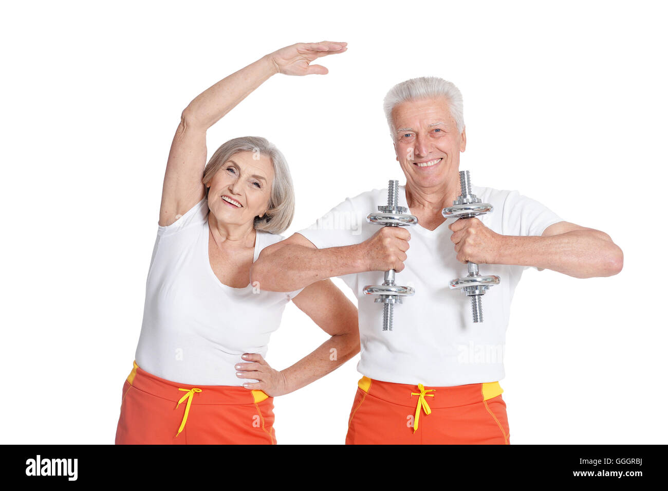 Senior Couple Exercising with dumbbells Banque D'Images