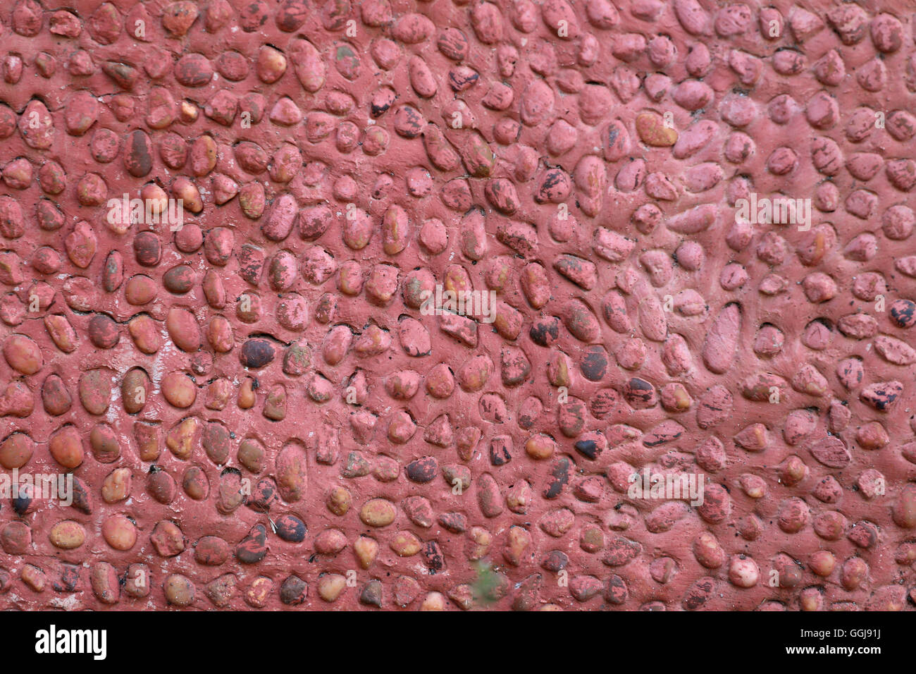 Mur en pierre Surface bétonnière rouge de l'intérieur de l'arrière-plan de conception. Banque D'Images