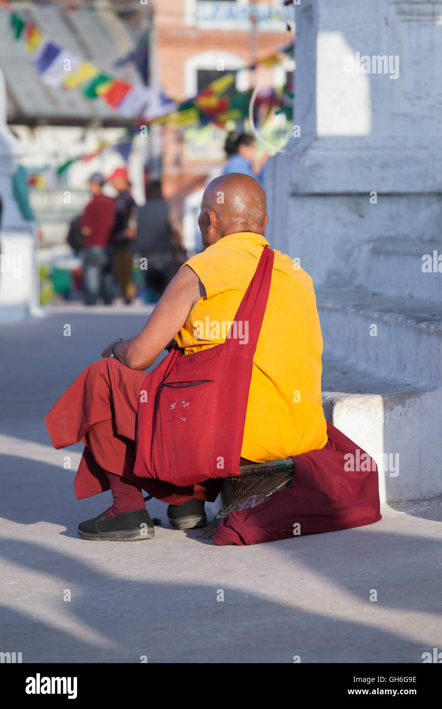 Moine tibétain au stupa de Boudhanath, Katmandou, Népal Banque D'Images