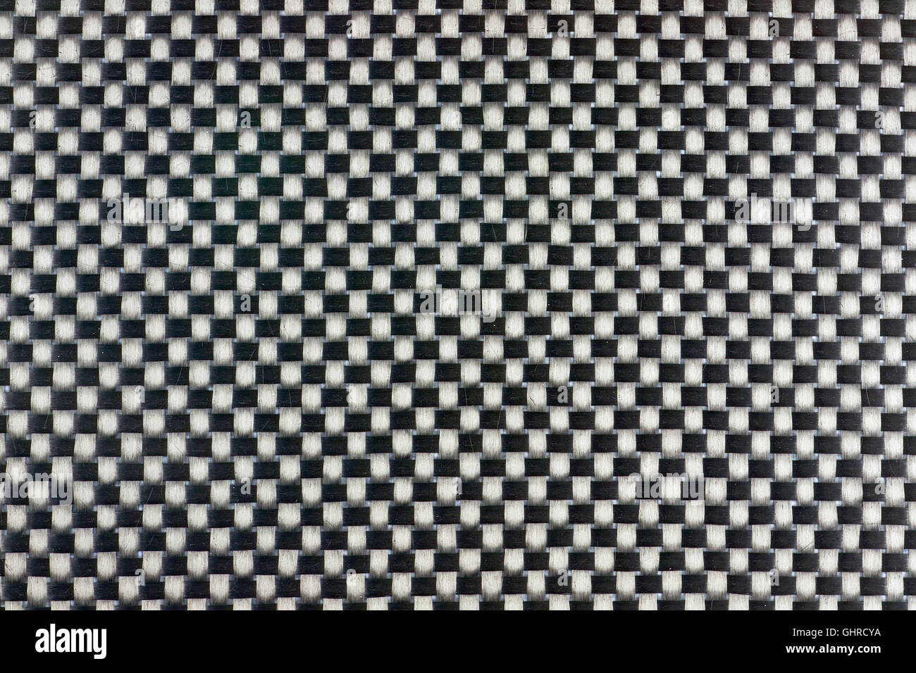 Fibre de carbone tissé serré de texture de fond. Macro. Banque D'Images