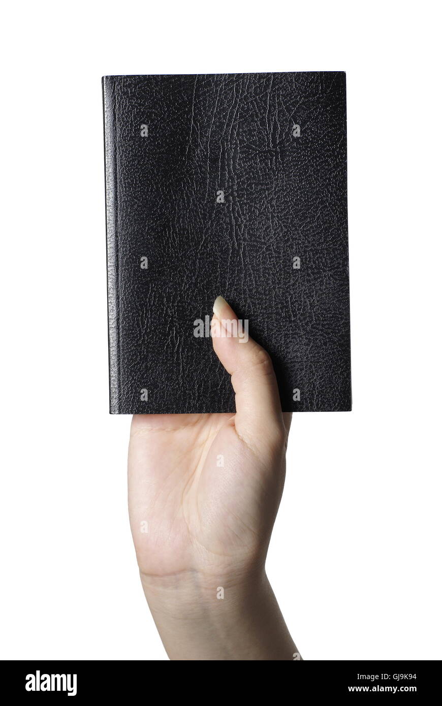 Bible Black book en main femelle avec fond blanc Banque D'Images
