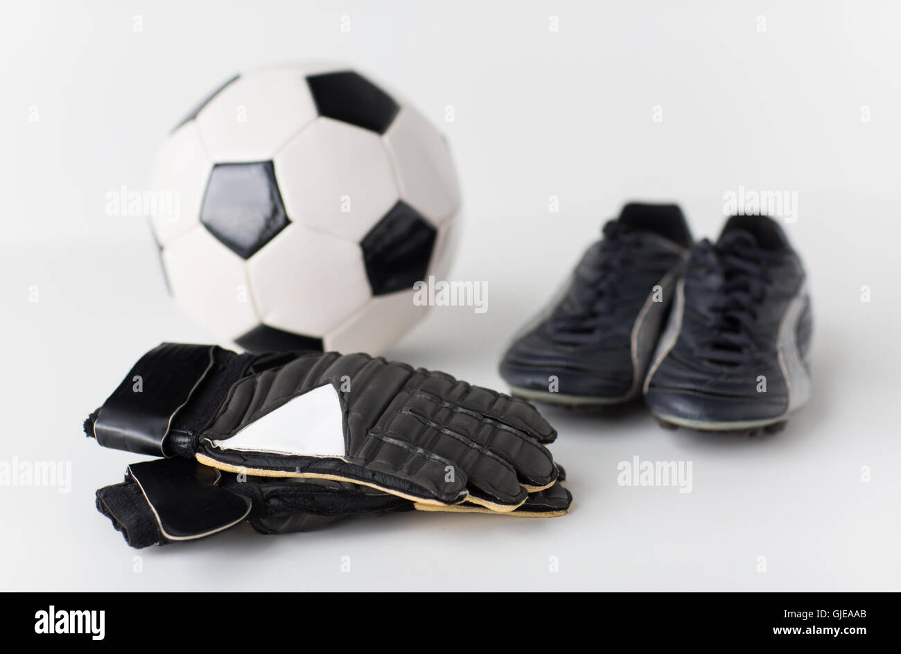 Close up de balle, gants, chaussures de football Banque D'Images