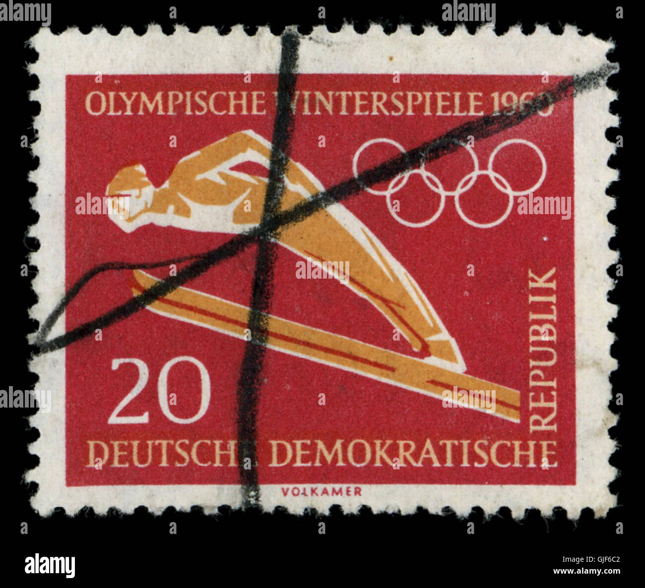 Ce timbre oblitéré à la main d'Allemagne de l'est, daté de 1960, a été marqué manuellement pour indiquer le paiement de l'affranchissement. Il reflète les pratiques postales manuelles en Allemagne de l'est à l'époque de la RDA. Banque D'Images