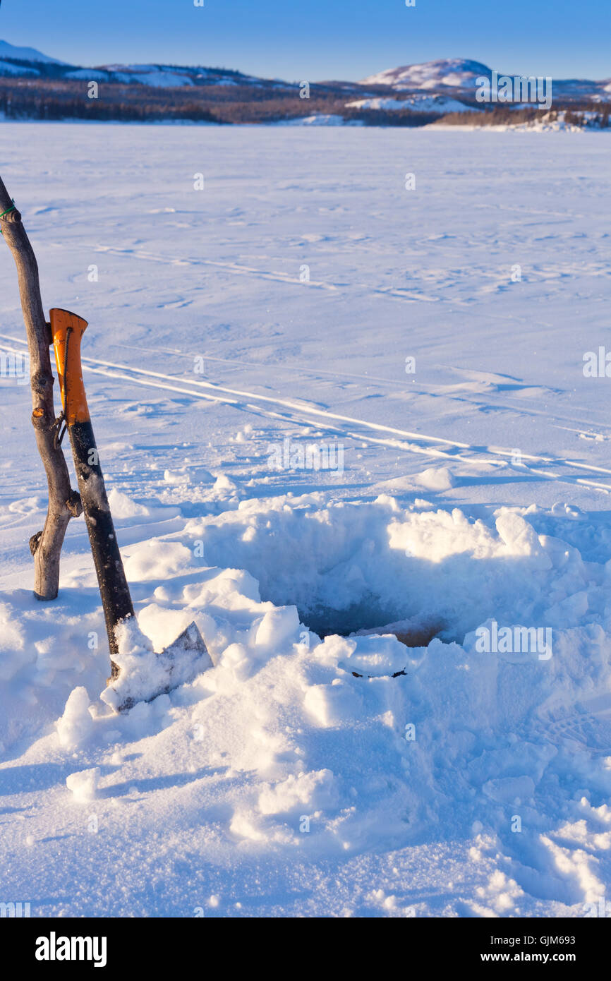 Trou de la pêche sur glace Banque D'Images