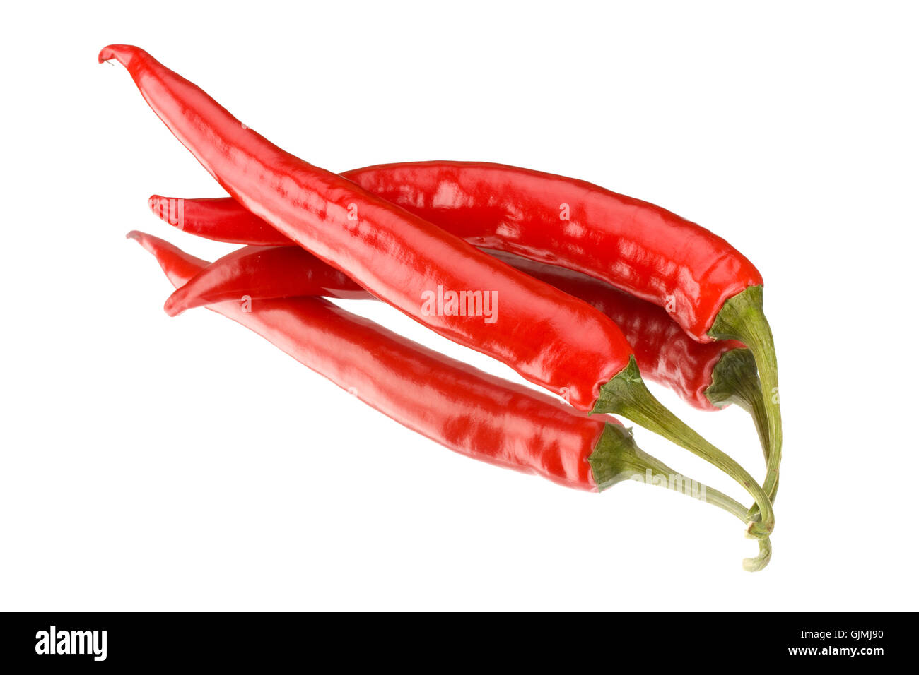 Deux red hot peppers sur un miroir Banque D'Images