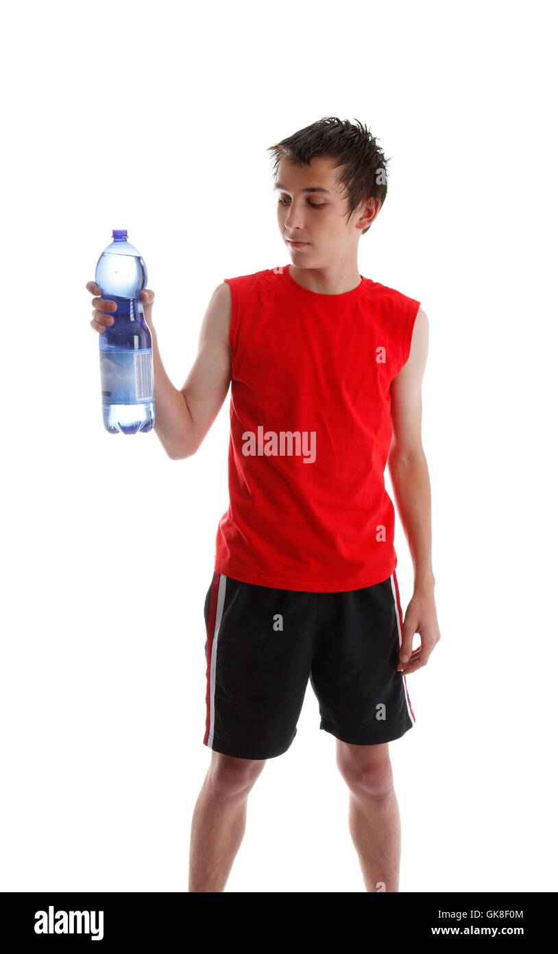 Adolescent holding grande bouteille d'eau Banque D'Images