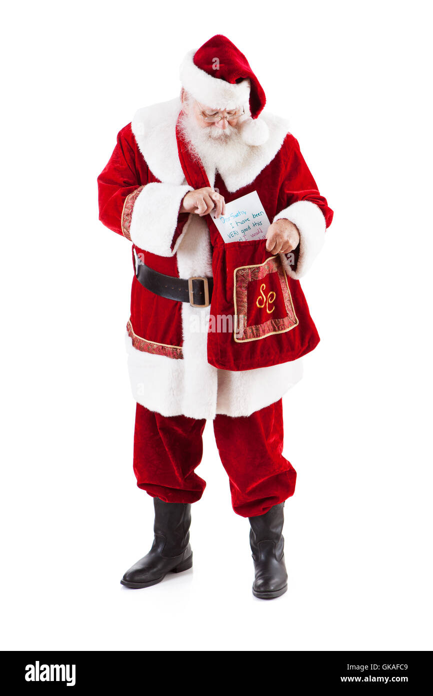 Authentique de style traditionnel avec du vrai Père Noël barbe et costume fait main. Isolé sur blanc pour Noël. Banque D'Images