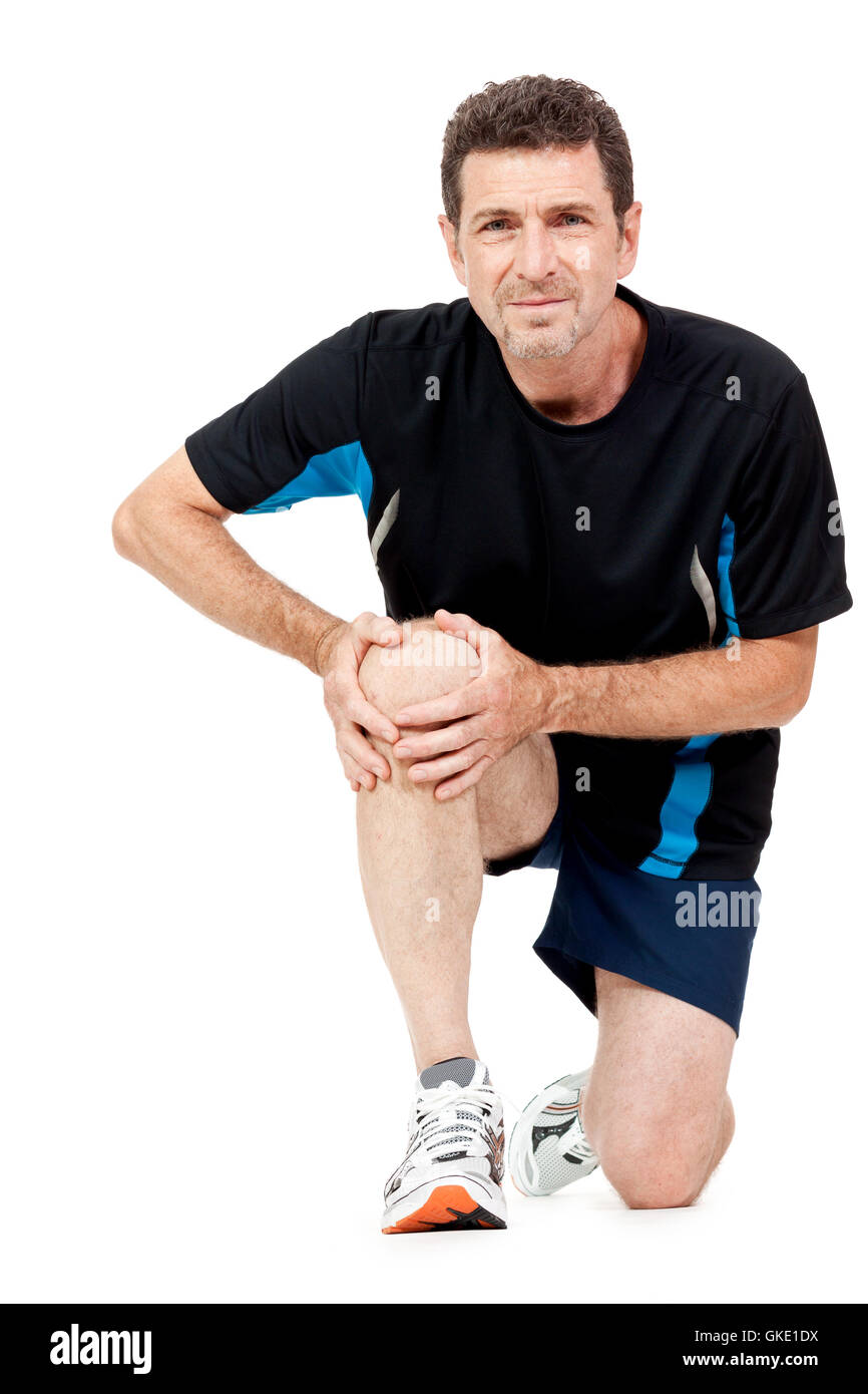 Un adultes dans les vêtements de sport et douleur au genou Banque D'Images