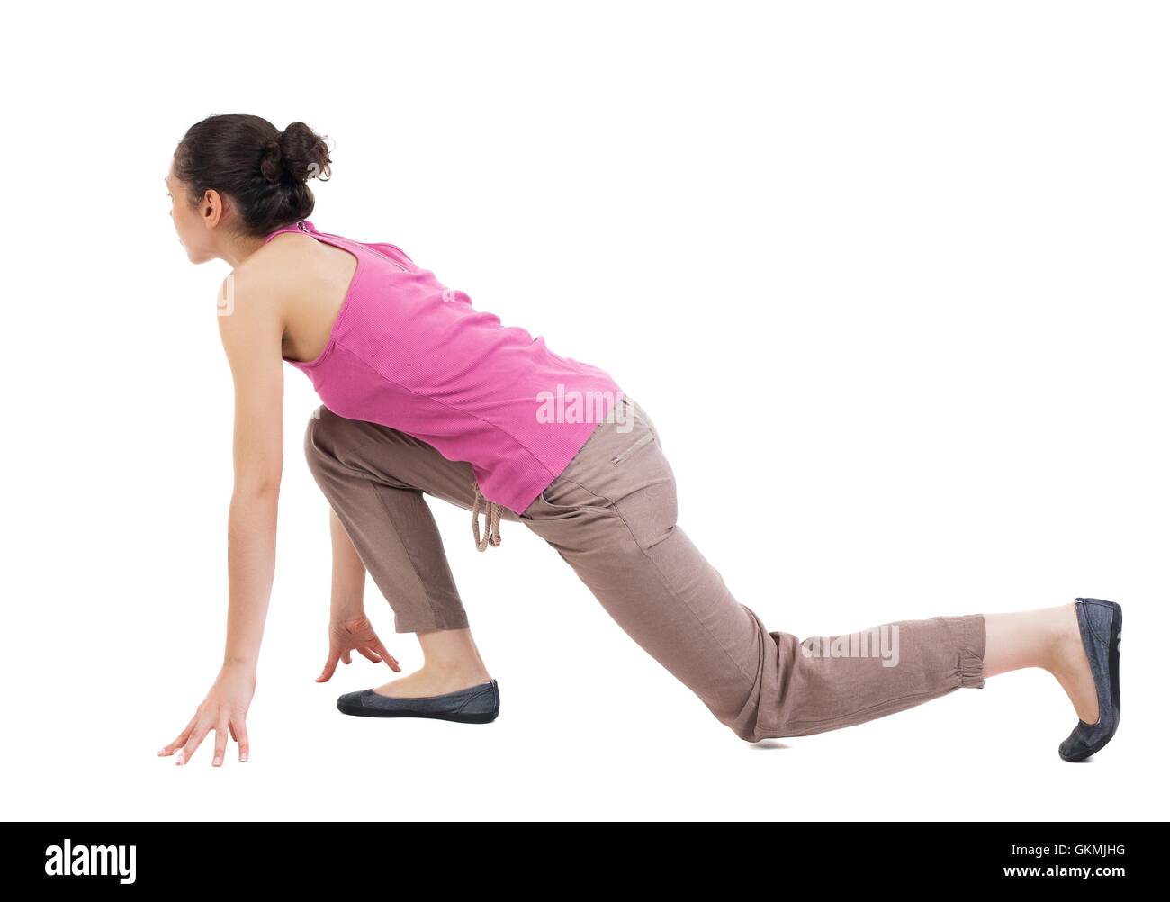 Femme vue de côté la position de départ. Vue arrière Vue arrière. collection les gens de personne. Plus isolé sur fond blanc. Curly femme afro-américaine en pantalon brun Banque D'Images