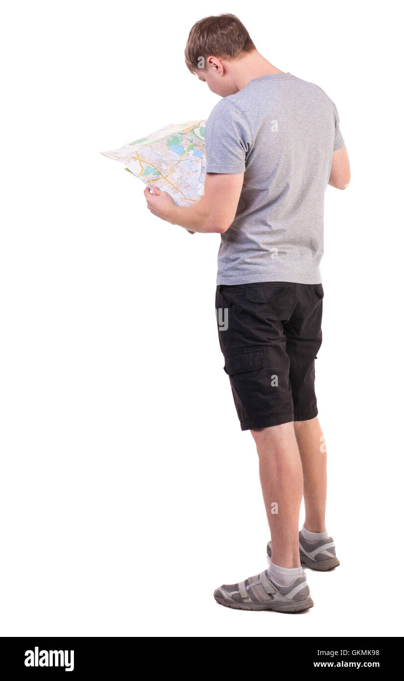 Vue arrière de voyage Jeune homme regardant la carte. Vue arrière Vue arrière. collection les gens de personne. L'homme dans les activités de plein air. Plus isolé sur fond blanc. jeune touriste dans des vêtements d'été pour essayer de comprendre le plan Banque D'Images