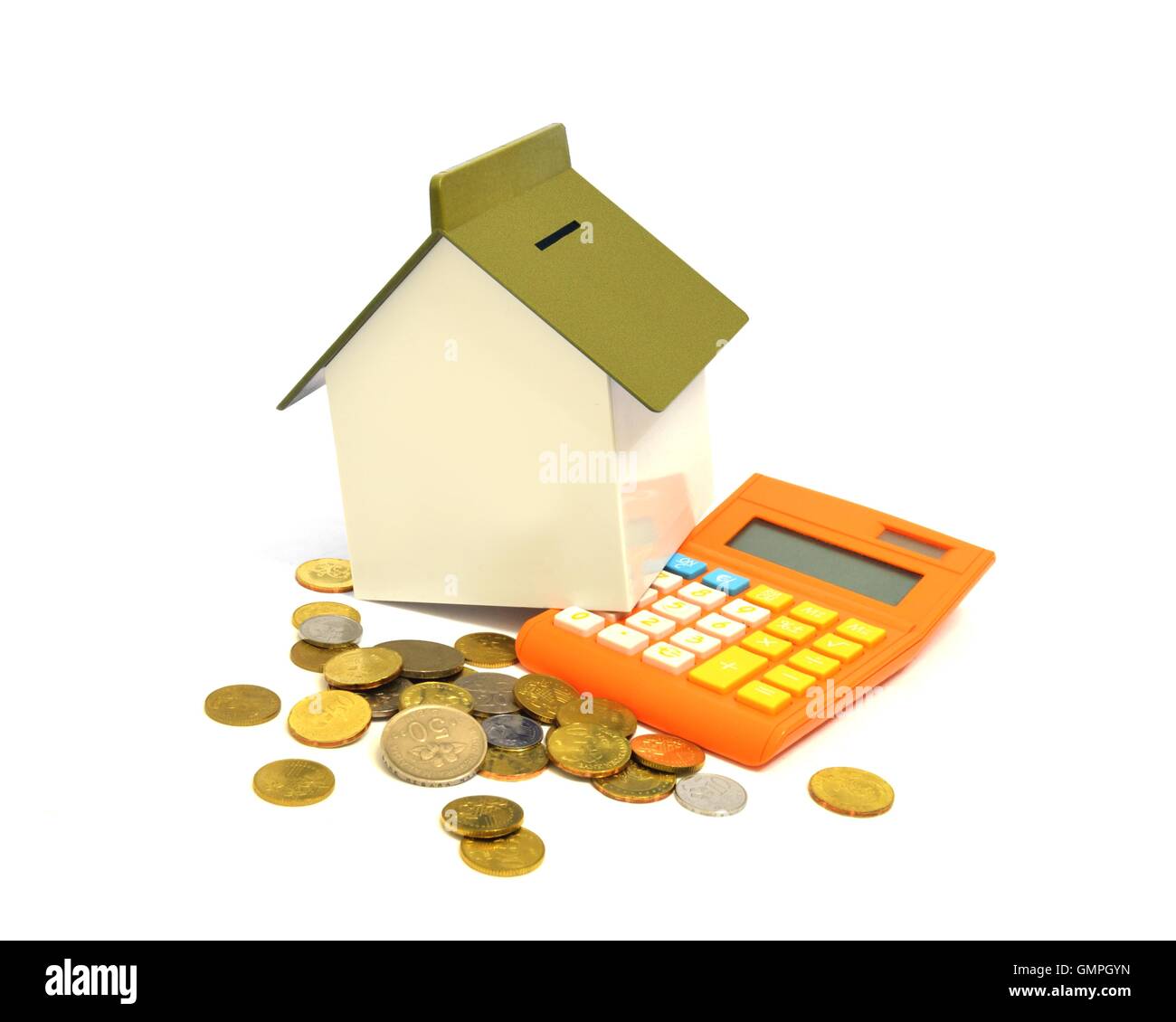 House, calculatrice et pièces, l'achat d'une propriété concept Banque D'Images
