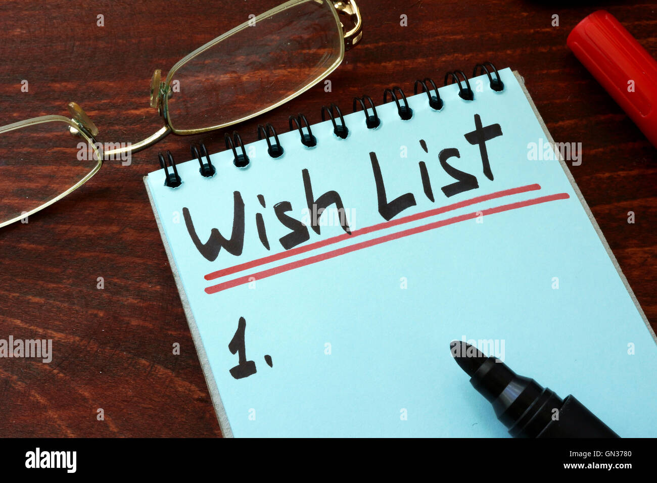 Liste de souhaits écrits sur un bloc-notes avec le marqueur. Banque D'Images