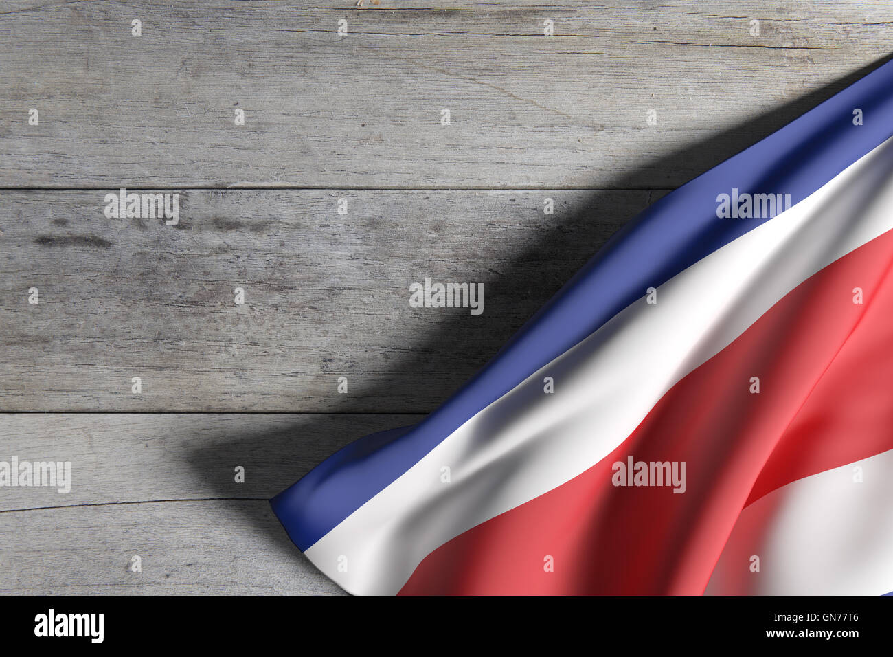 Le rendu 3D de la République du Costa Rica drapeau sur une surface en bois Banque D'Images