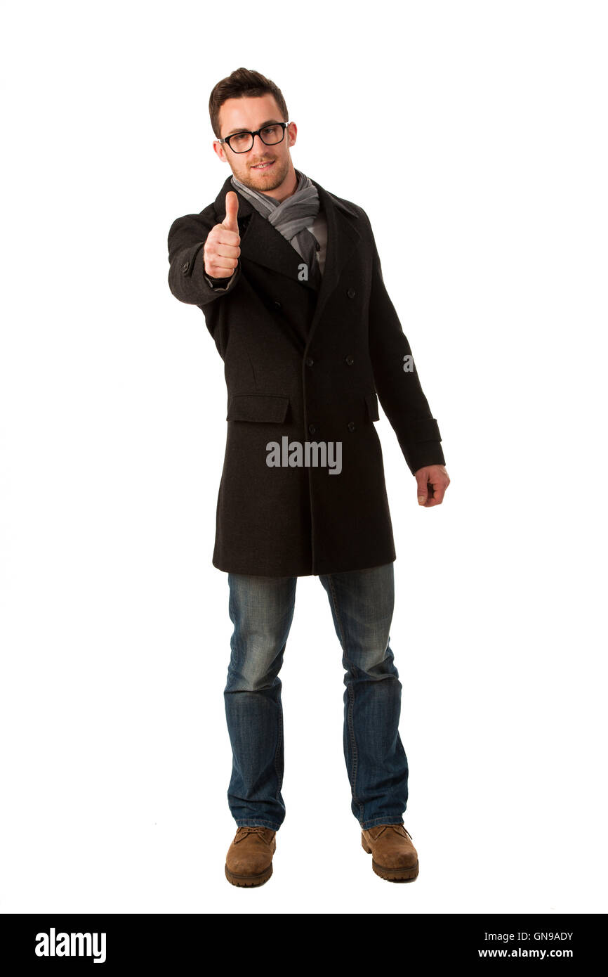 Confident businessman standing in winter coat montrant un signe de réussite et de sourire. Banque D'Images