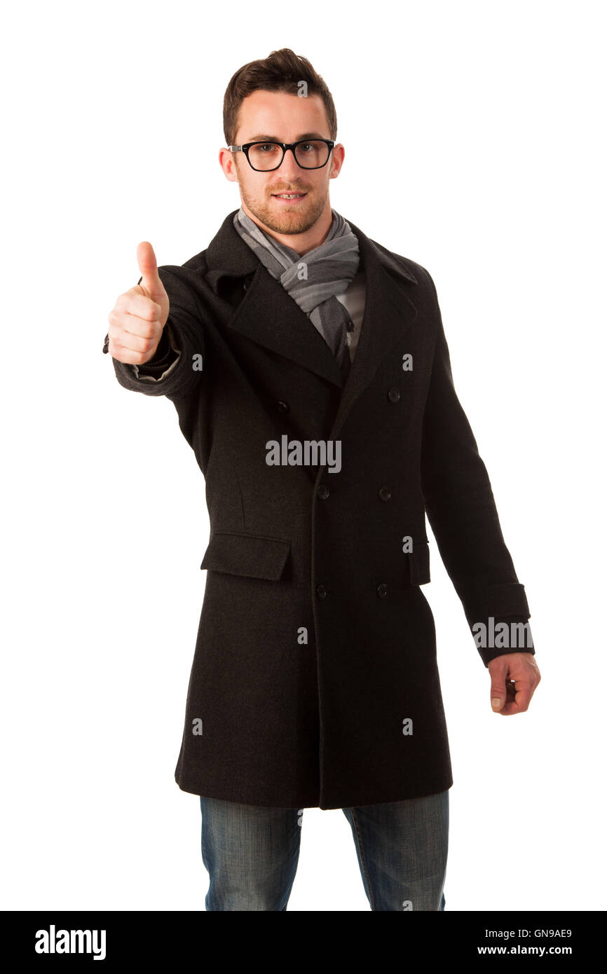 Confident businessman standing in winter coat montrant un signe de réussite et de sourire. Banque D'Images