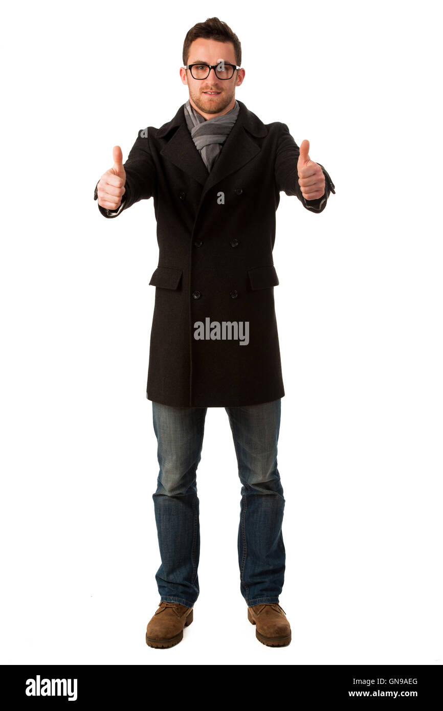 Confident businessman standing in winter coat montrant un signe de réussite et de sourire. Banque D'Images