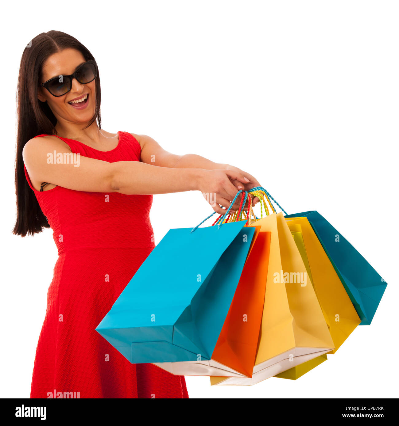 Beau young woman with shopping bags isolated over white background Banque D'Images