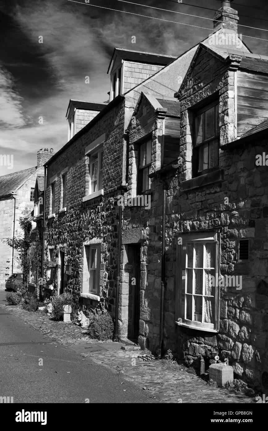 Cottages en pierre sur l'Île Sainte de Lindisfarne, Northumberland, Angleterre du Nord-Est, Royaume-Uni Banque D'Images