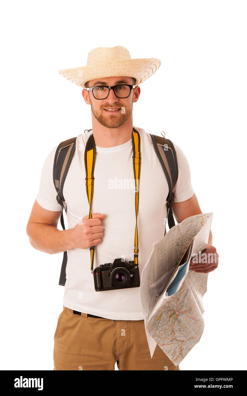 Traveler avec chapeau de paille, chemise blanche, sac à dos de l'appareil photo et d'explorer de nouveaux monde isolé. Banque D'Images