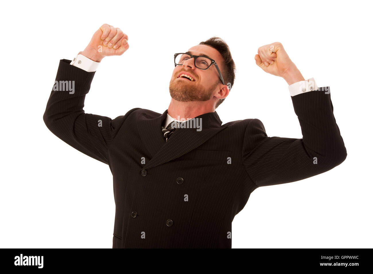 Excited businessman en costume officiel holding poings et smiling happy Célébrons les succès isolés. Banque D'Images