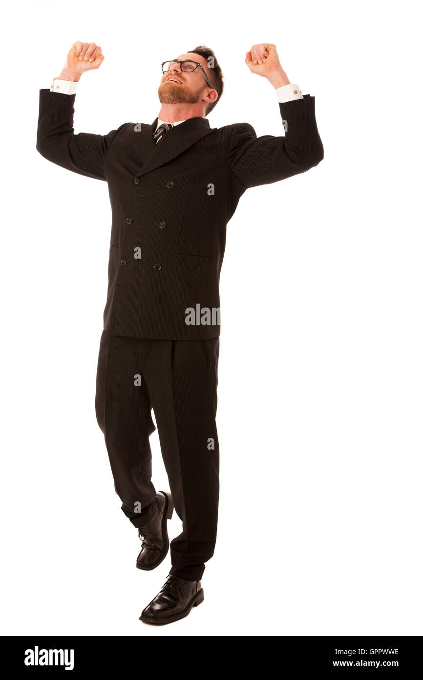 Excited businessman en costume officiel holding poings et smiling happy Célébrons les succès isolés. Banque D'Images