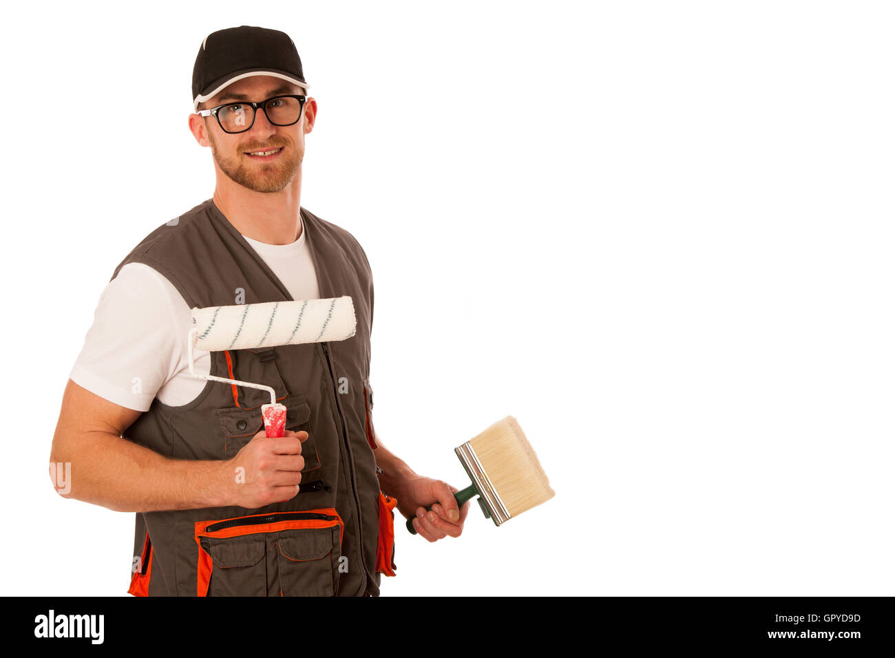 Handyman dans vêtements de travail avec outils de blanchiment isolated over white. Banque D'Images