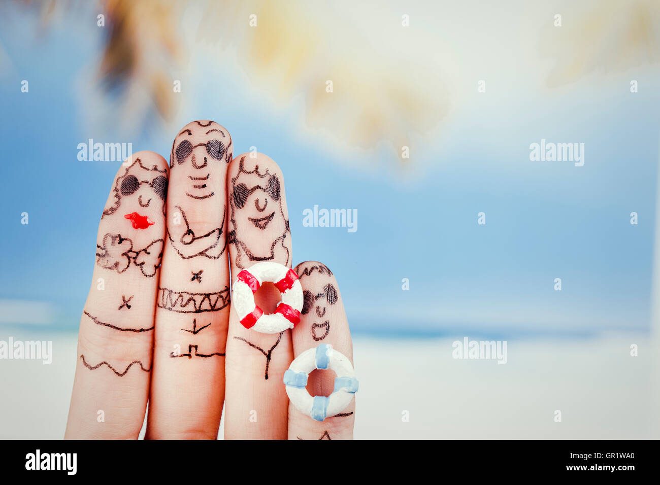 Famille harmonieuse en vacances par l'art du doigt Banque D'Images
