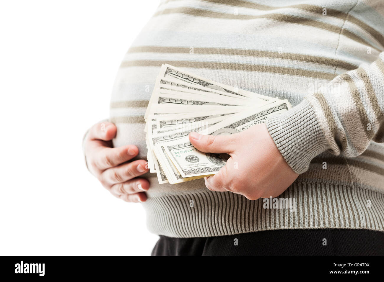Pregnant woman holding en devises en dollar Banque D'Images