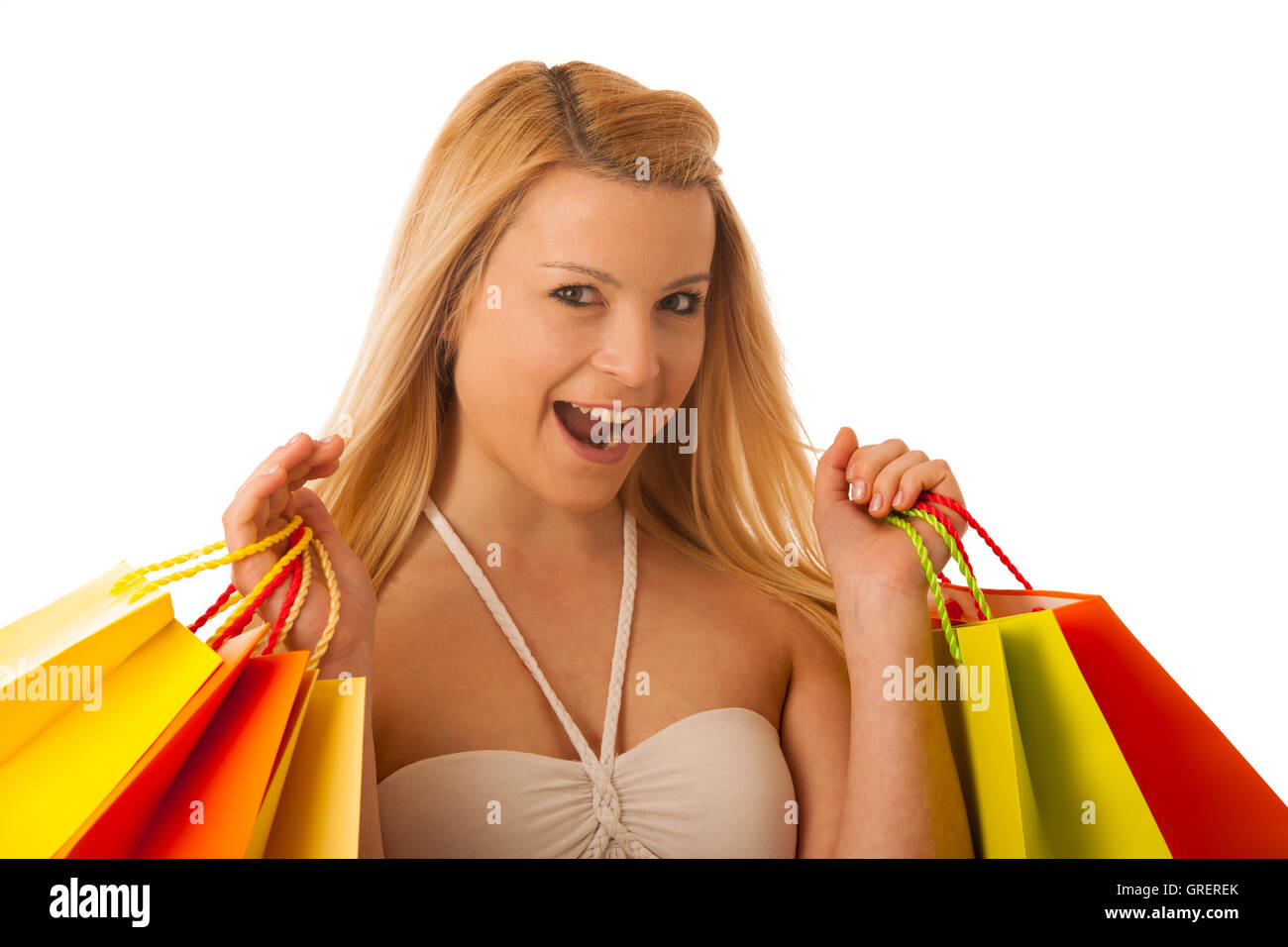 Cute blonde woman with shopping bags dynamique isolated over white background studio shot Banque D'Images