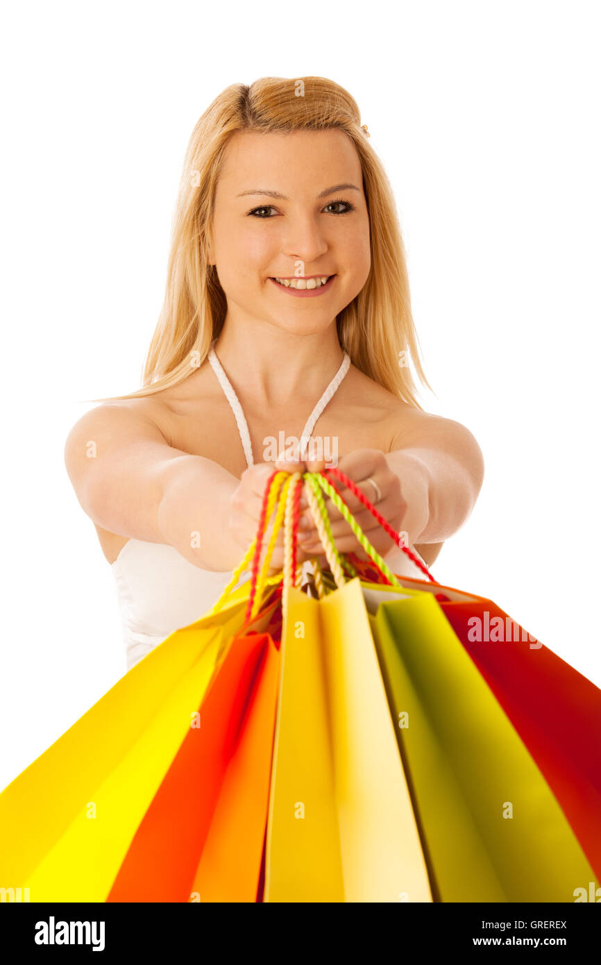 Cute blonde woman with shopping bags dynamique isolated over white background studio shot Banque D'Images