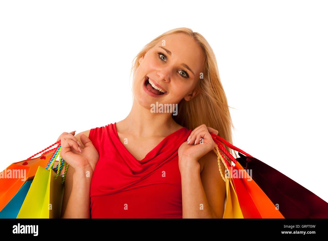 Belle jeune femme avec des sacs de magasinage le consumérisme isolated over white backgeeound Banque D'Images