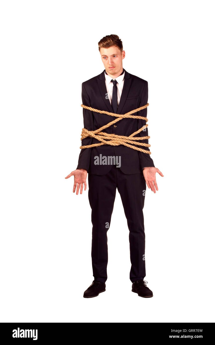 Portrait en pied de businessman tied avec la corde, isolé sur blanc. Concept de l'esclavage et la violence Banque D'Images