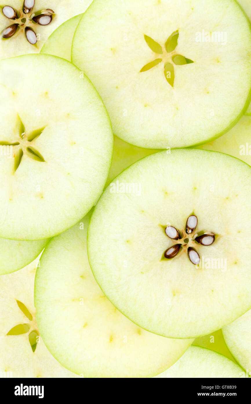 Motif de fond conceptuel et la texture des tranches de pommes biologiques vert avec le détail formant une belle étoile pour Banque D'Images