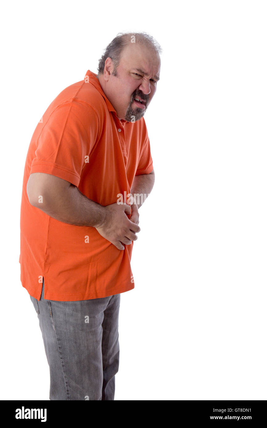 Homme d'âge moyen avec la constipation grimaçait de douleur quand il griffes son estomac en déroute à cause de la compaction de ses fèces et je Banque D'Images