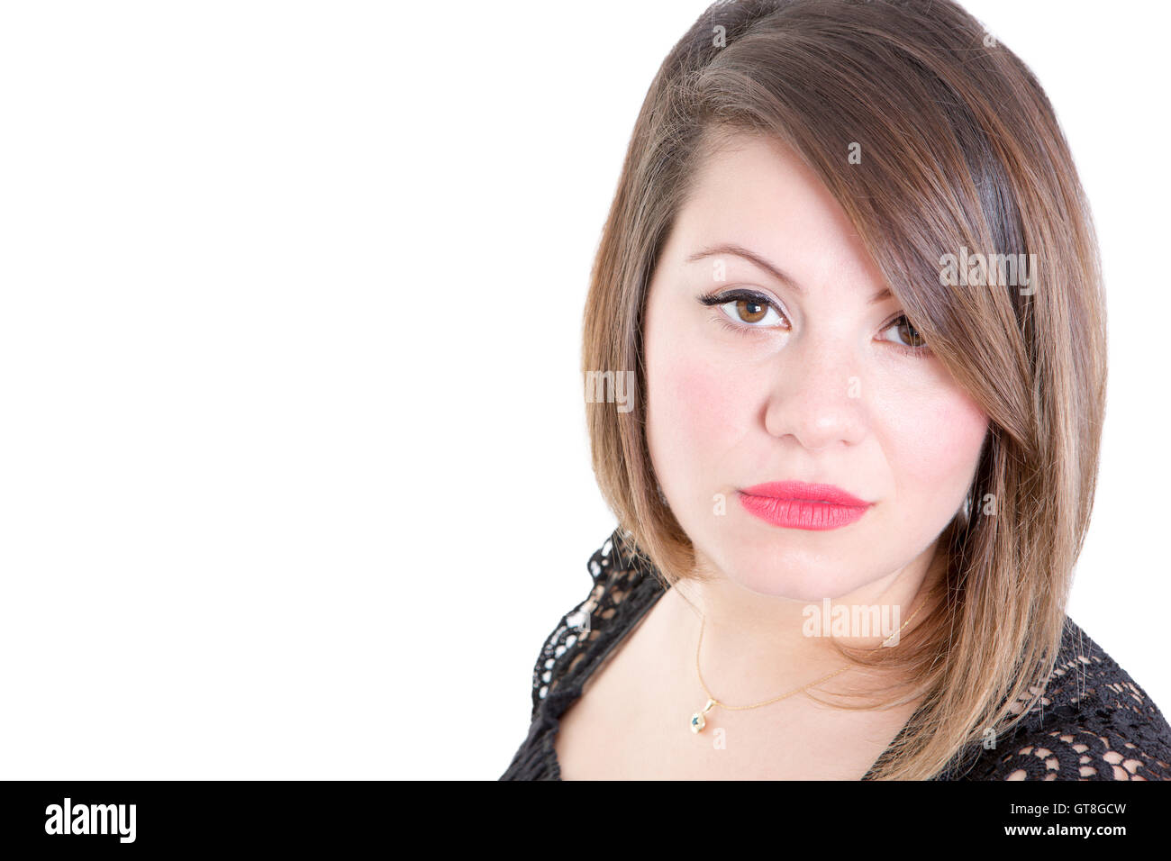 Close up Pretty Young Woman Looking at the Camera Against White Background with Copy Space. Banque D'Images