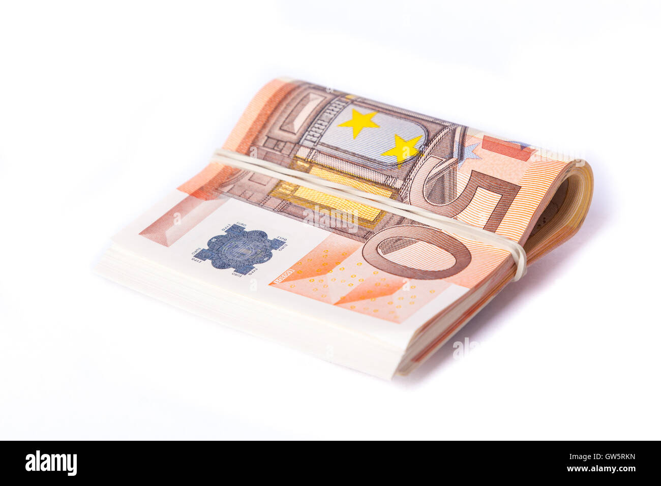 50 billets de banque roulés enveloppés et pile Banque D'Images