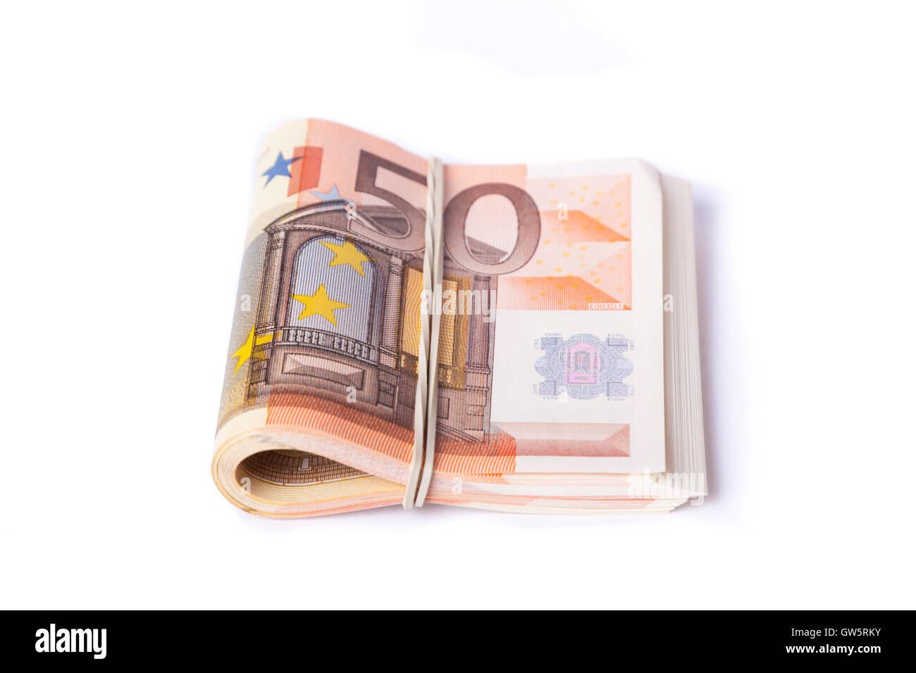 50 billets de banque roulés enveloppés et pile Banque D'Images