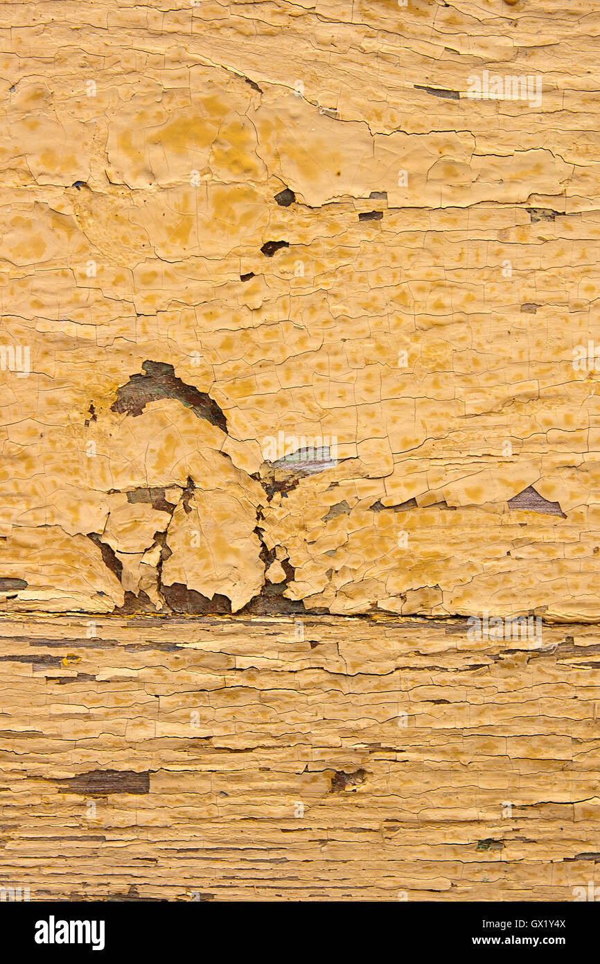 Texture bois avec peinture la couleur est arrachée. Peinture jaune écaillée - texture de fond en bois. Banque D'Images
