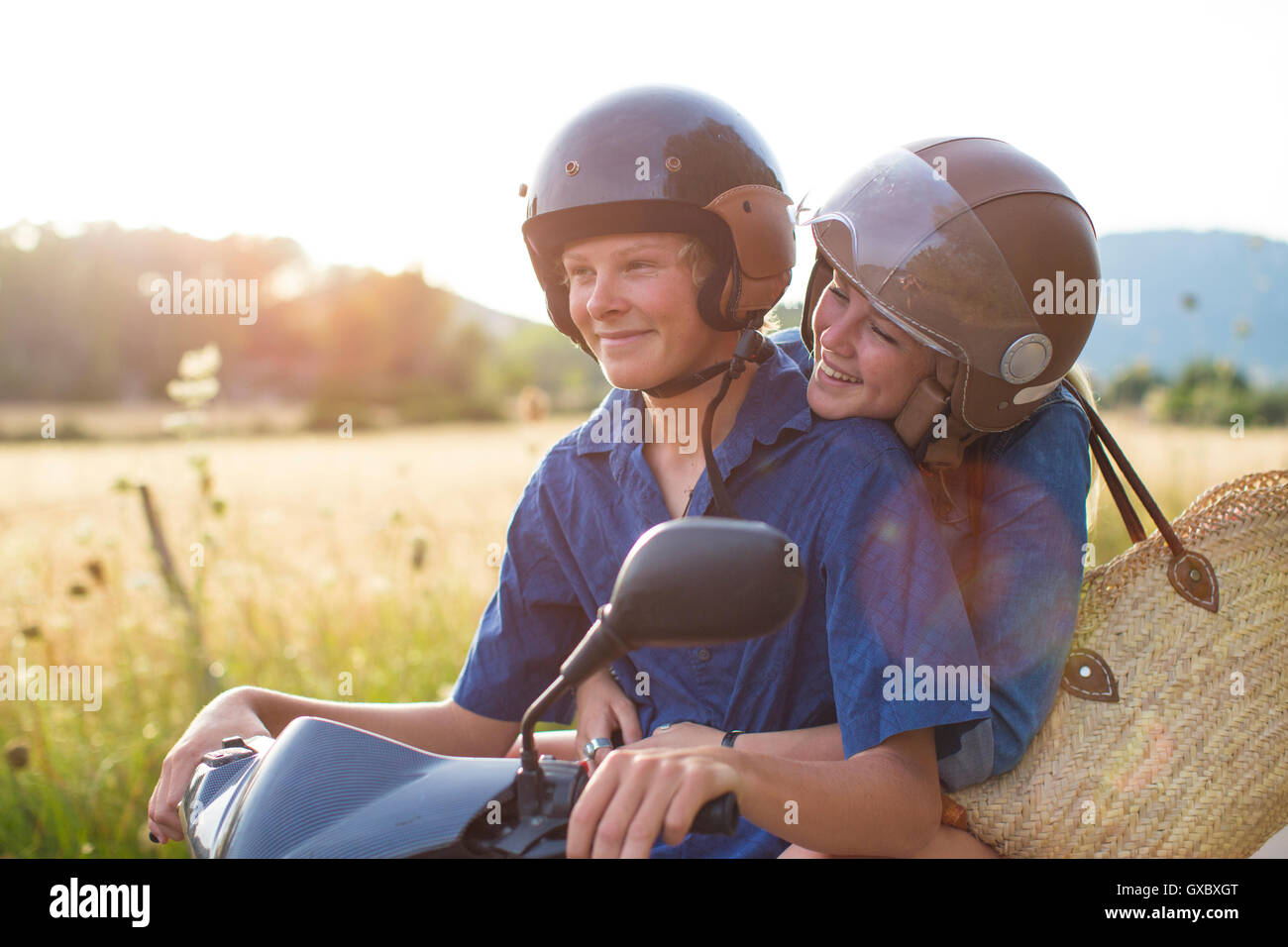 Happy riding moped on rural road, Majorque, Espagne Banque D'Images