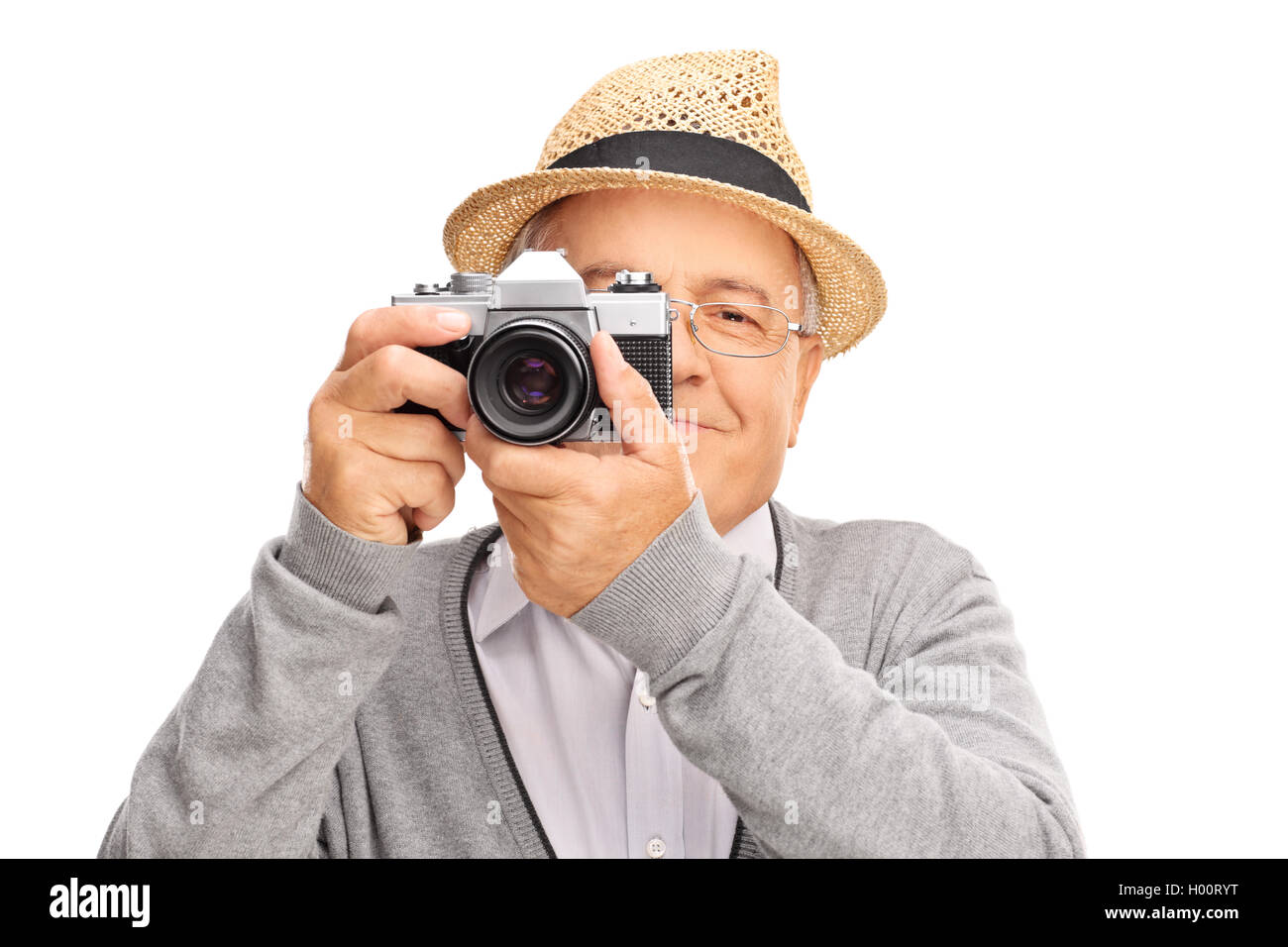 Homme mûr de prendre une photo avec un appareil isolé sur fond blanc Banque D'Images