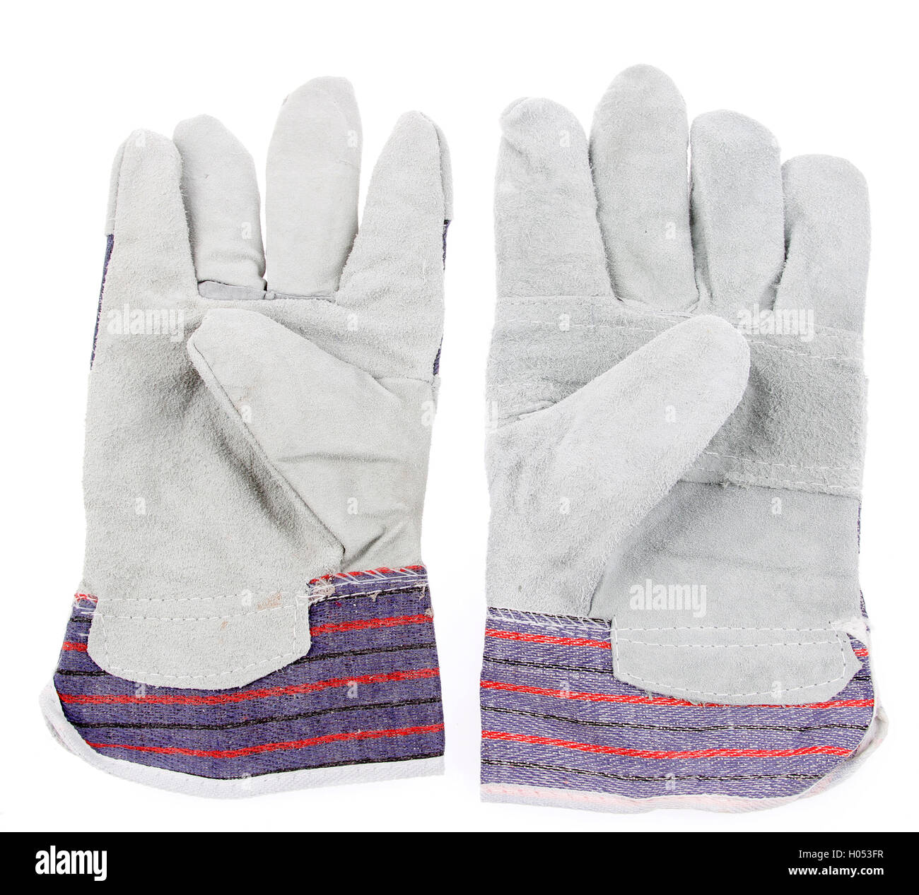 Paire de gants de travail sur fond uni Banque D'Images