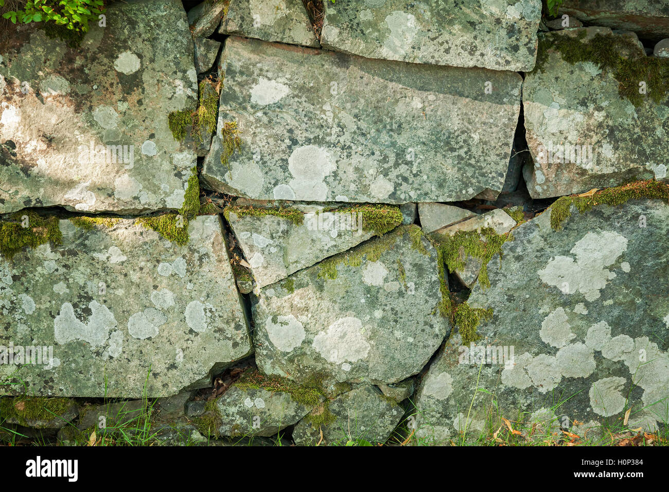 Image de mur en pierres naturelles en toile de fond. Banque D'Images