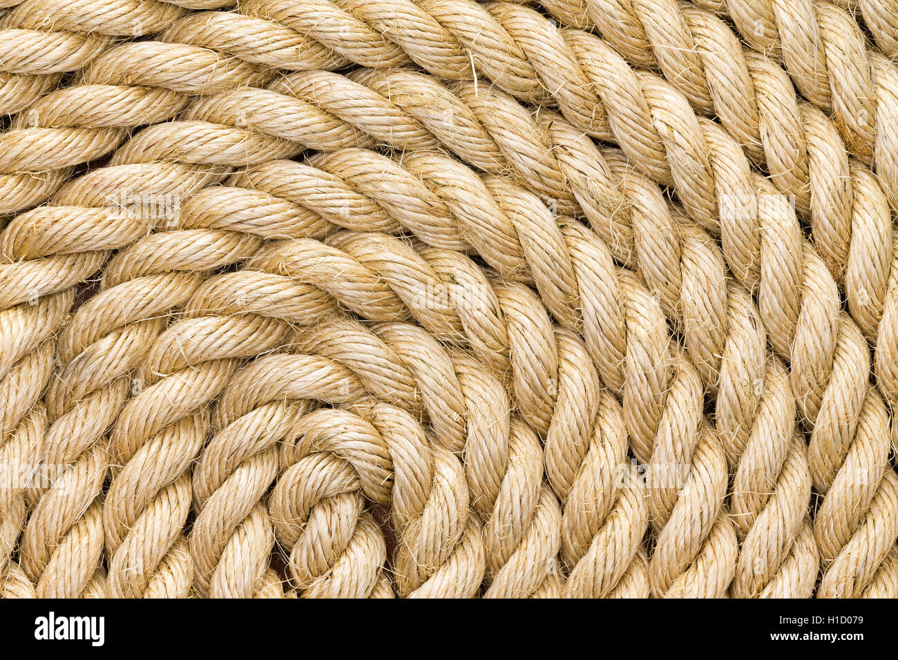 Texture de fond corde parfaitement enroulés en une bobine montrant le détail de la jute naturel, les fibres de chanvre ou de sisal dans un vi Banque D'Images