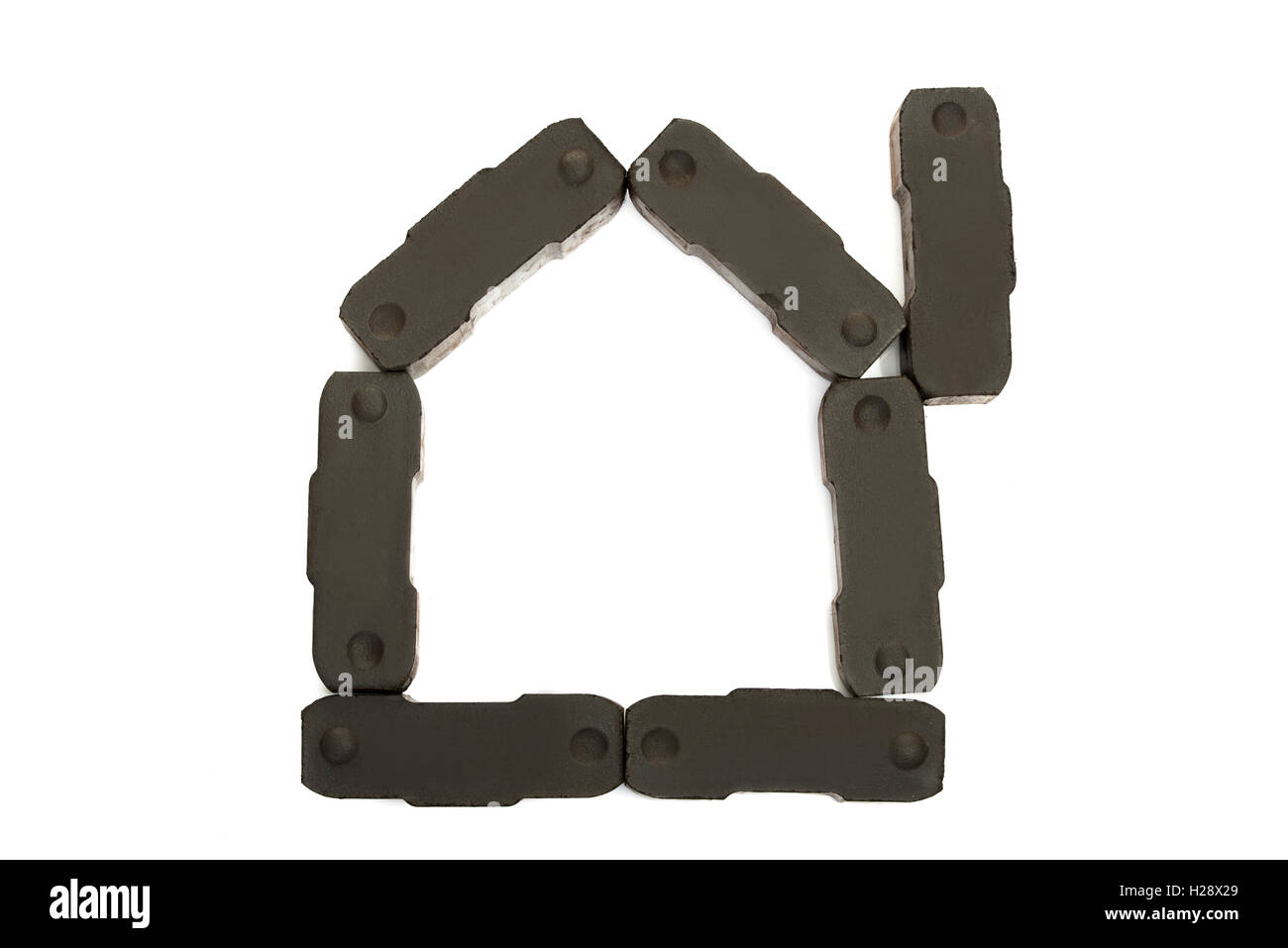 Composition des éléments du charbon en forme de maison. Banque D'Images